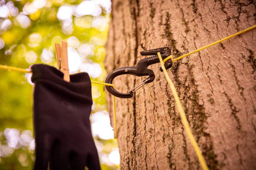 Using the Nite Ize Figure 9 Carabiner to set up a clothesline on a tree