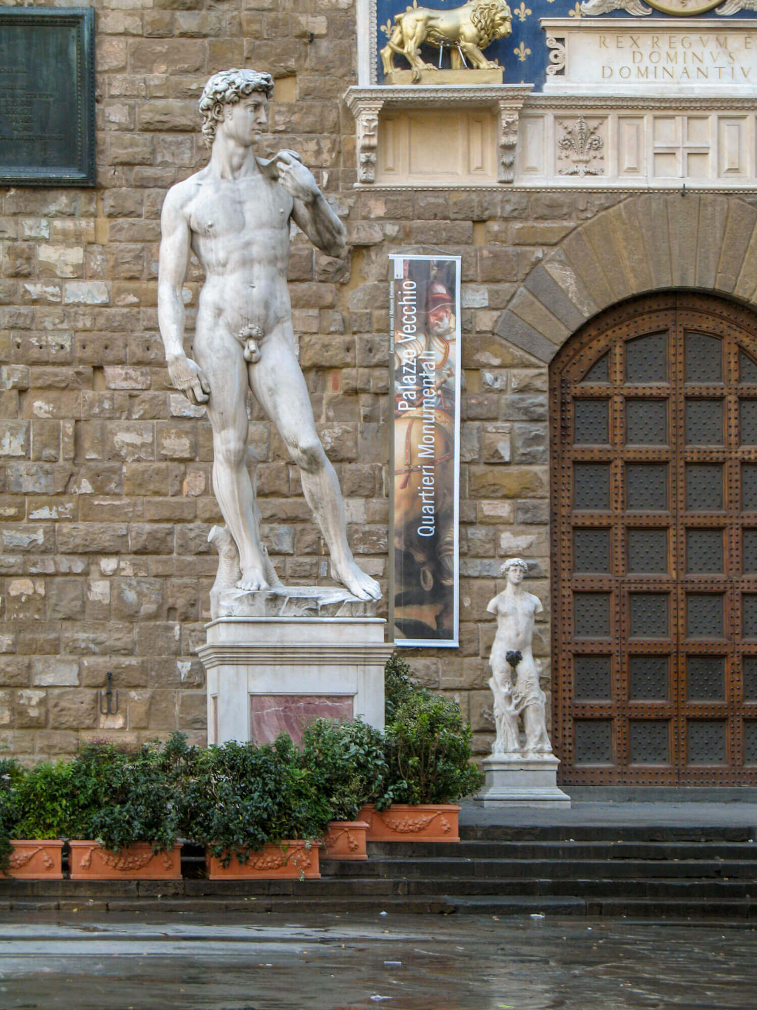 A replica of Michelangelo's David stands outside the Palazzo Vecchio where the original once stood, before being moved to the Galleria dell'Accademia