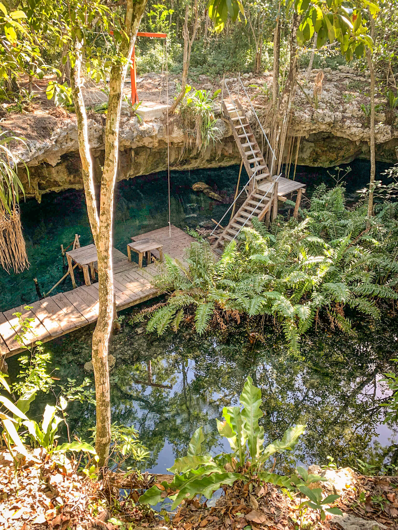 The Dreamgate Cenote near Tulum, with steps down to the water for scuba divers