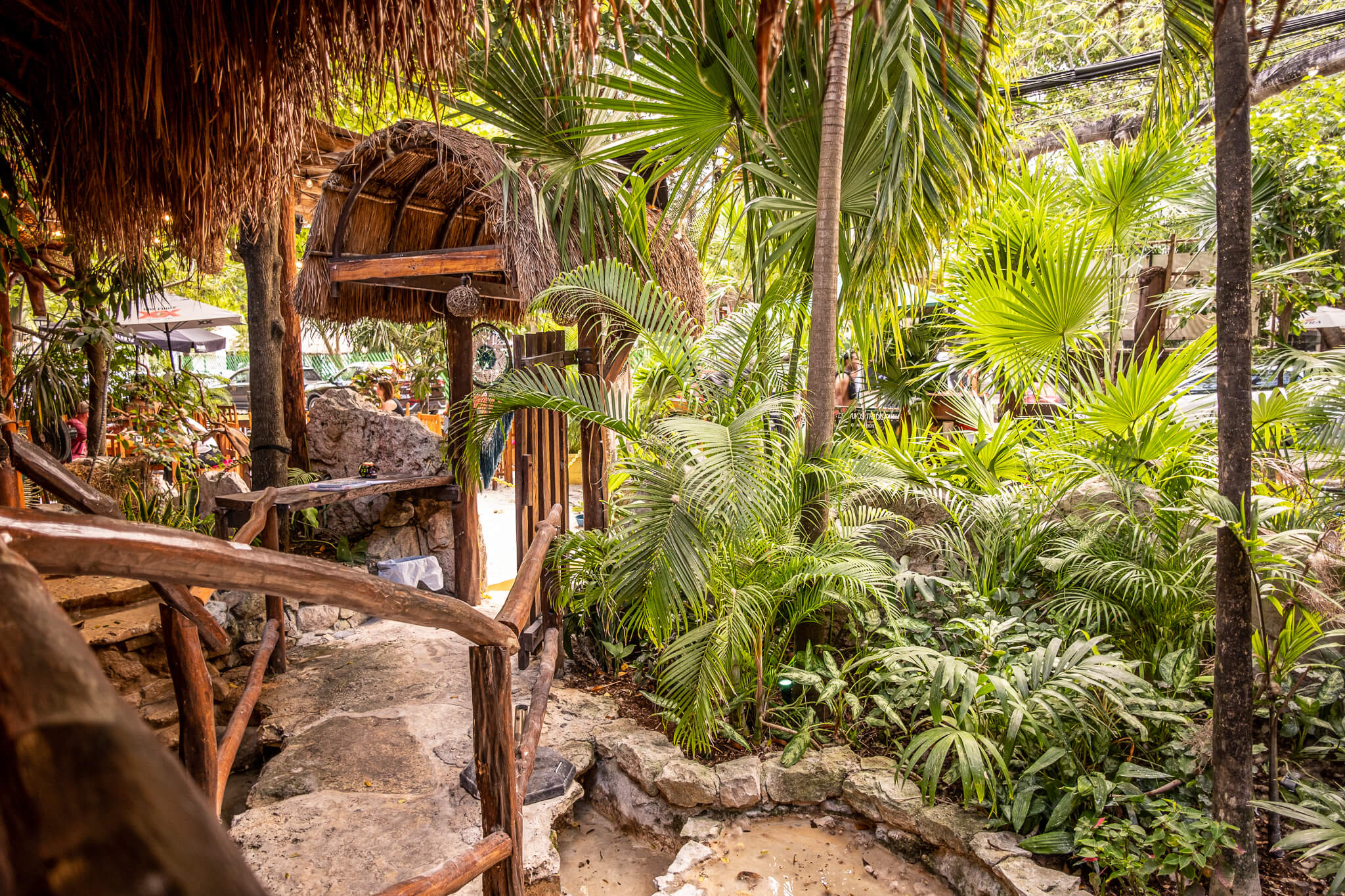 The garden-like interior of La Perla Pixan restaurant in Playa del Carmen