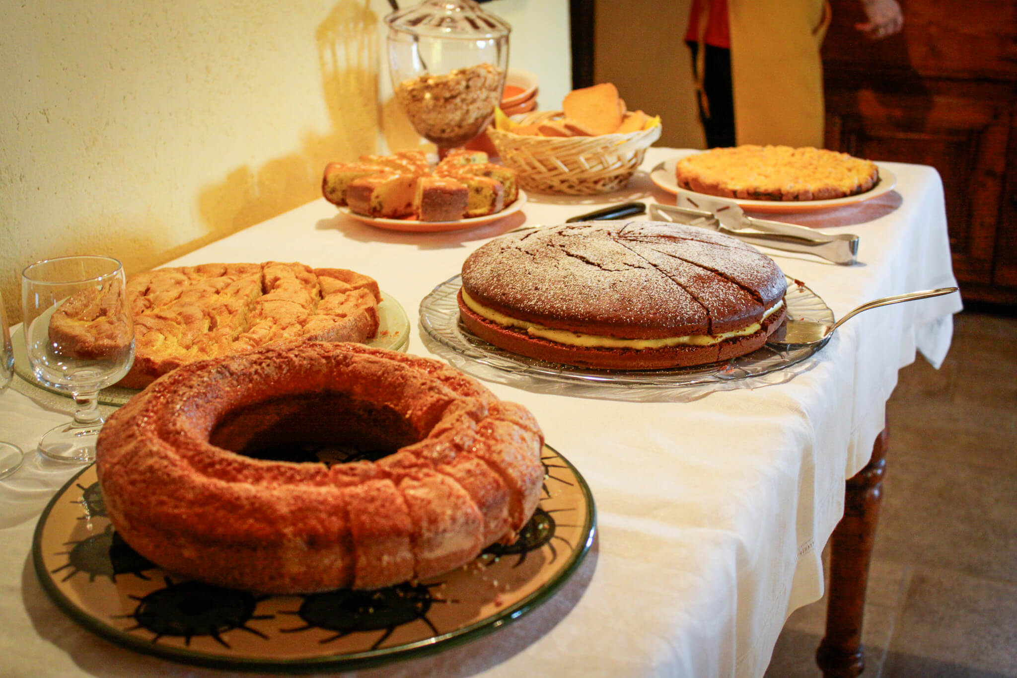 A delicious spread of cakes for breakfast at our agriturismo in Le Marche, Italy