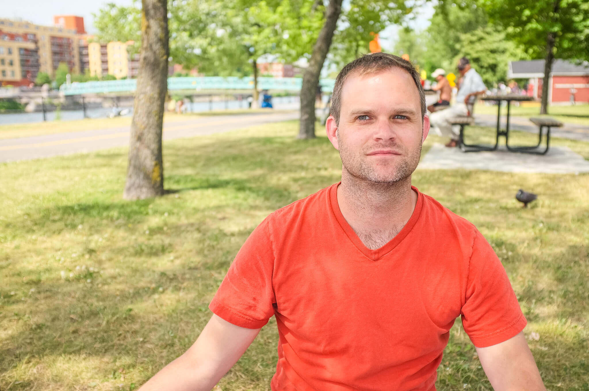 Man having a picnic along the Lachine Canal in Montreal