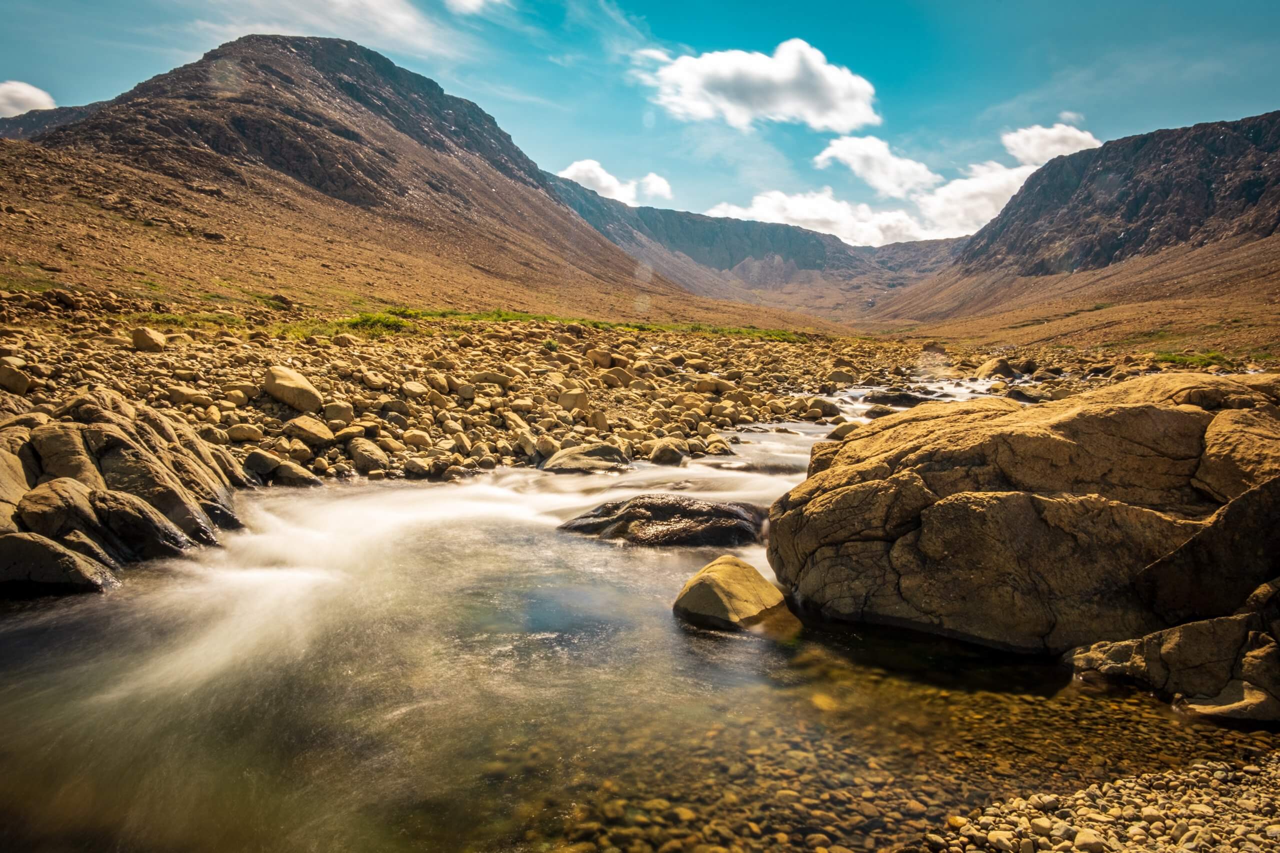 A long exposure photo of a stream running through the Tablelands in Gros Morne National Park