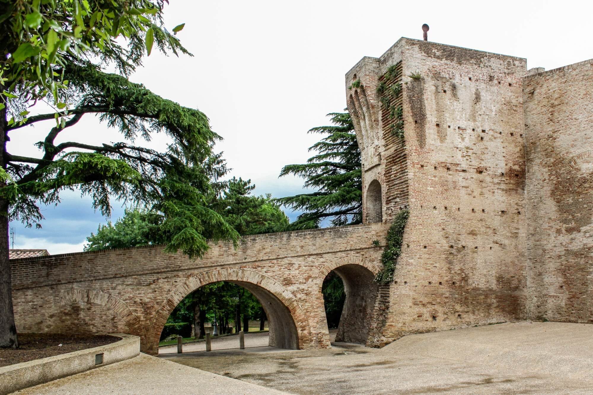 The Mondavio fortress tower grading the walkway, with the keep in the background