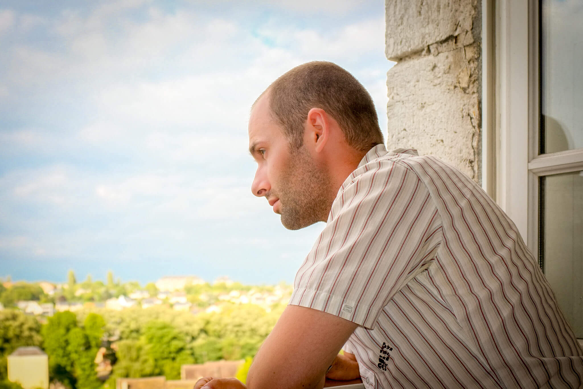 Me, looking out of our window from Hôtellerie Saint-Yves, overlooking Chartres, France