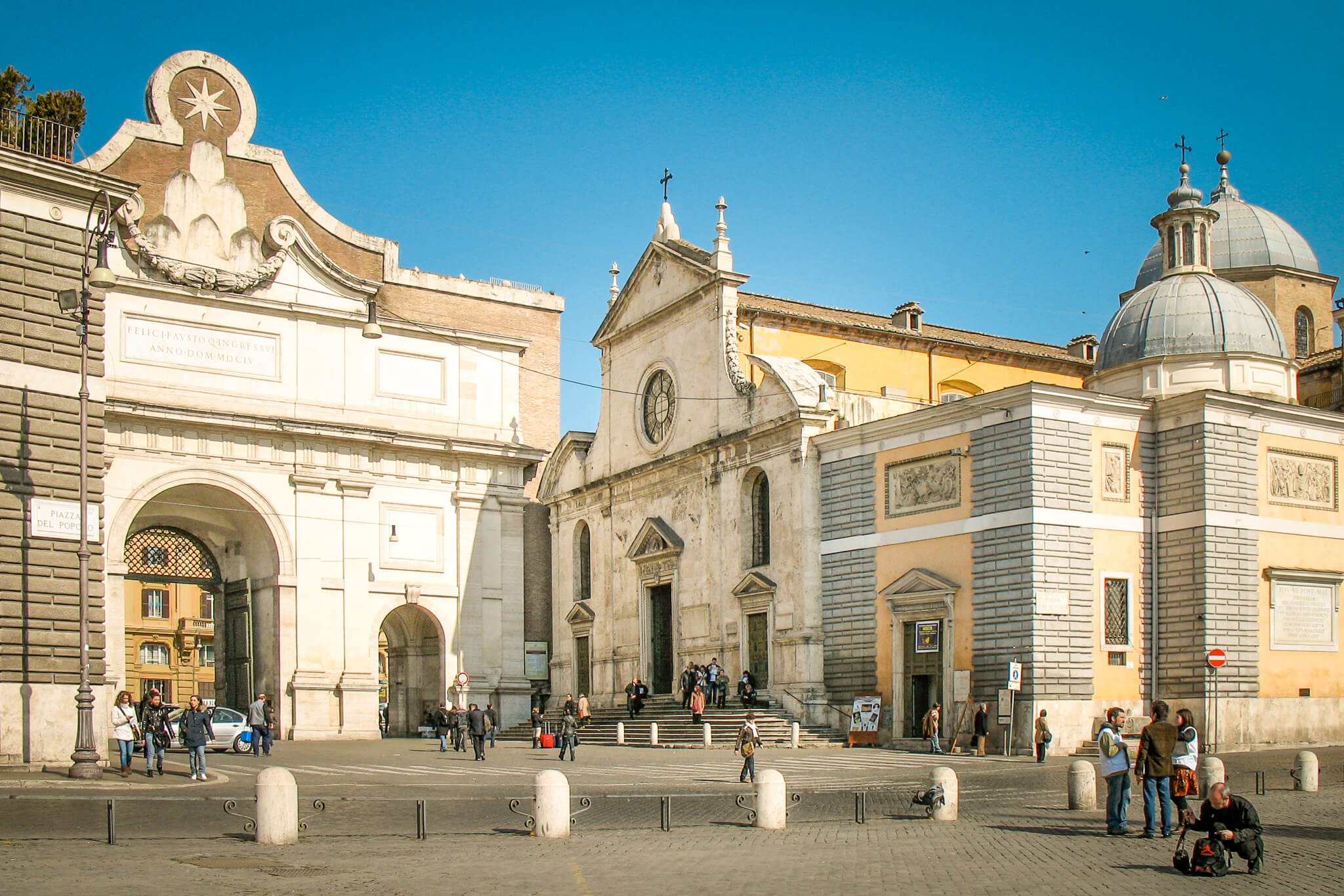 The exterior of Santa Maria del Popolo and the Porta del Popolo