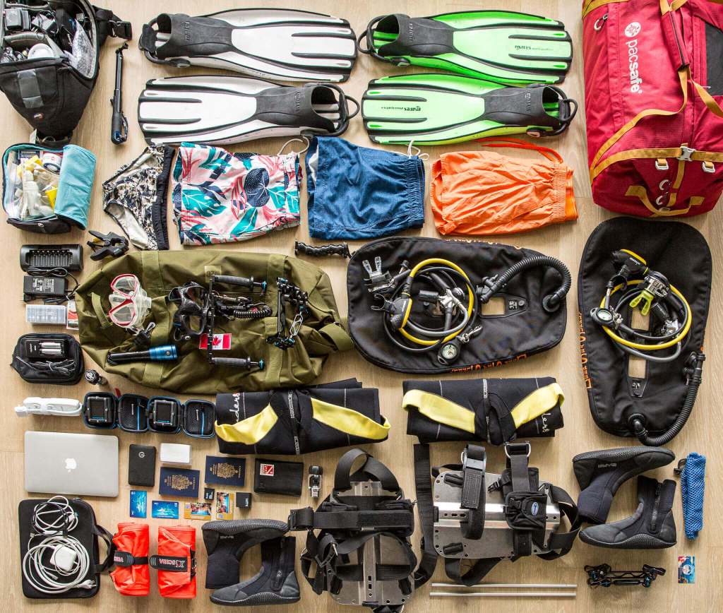 Scuba gear laid out for packing for a scuba liveaboard trip