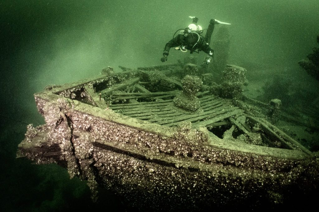 A scuba diver exploring the City of Sheboygan shipwreck