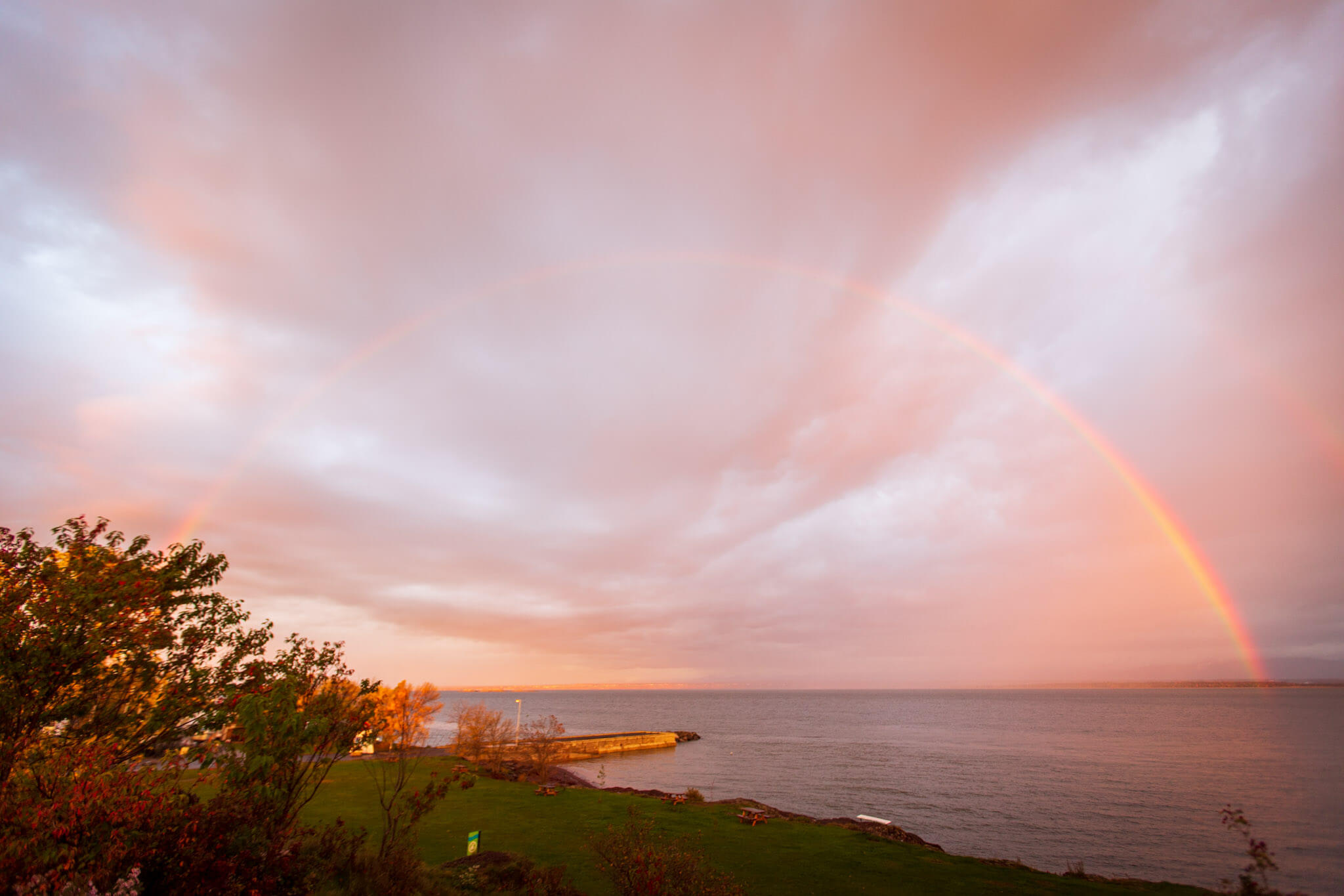 A rainbow at dawn over the St. Lawrence river in Berthier-sur-Mer