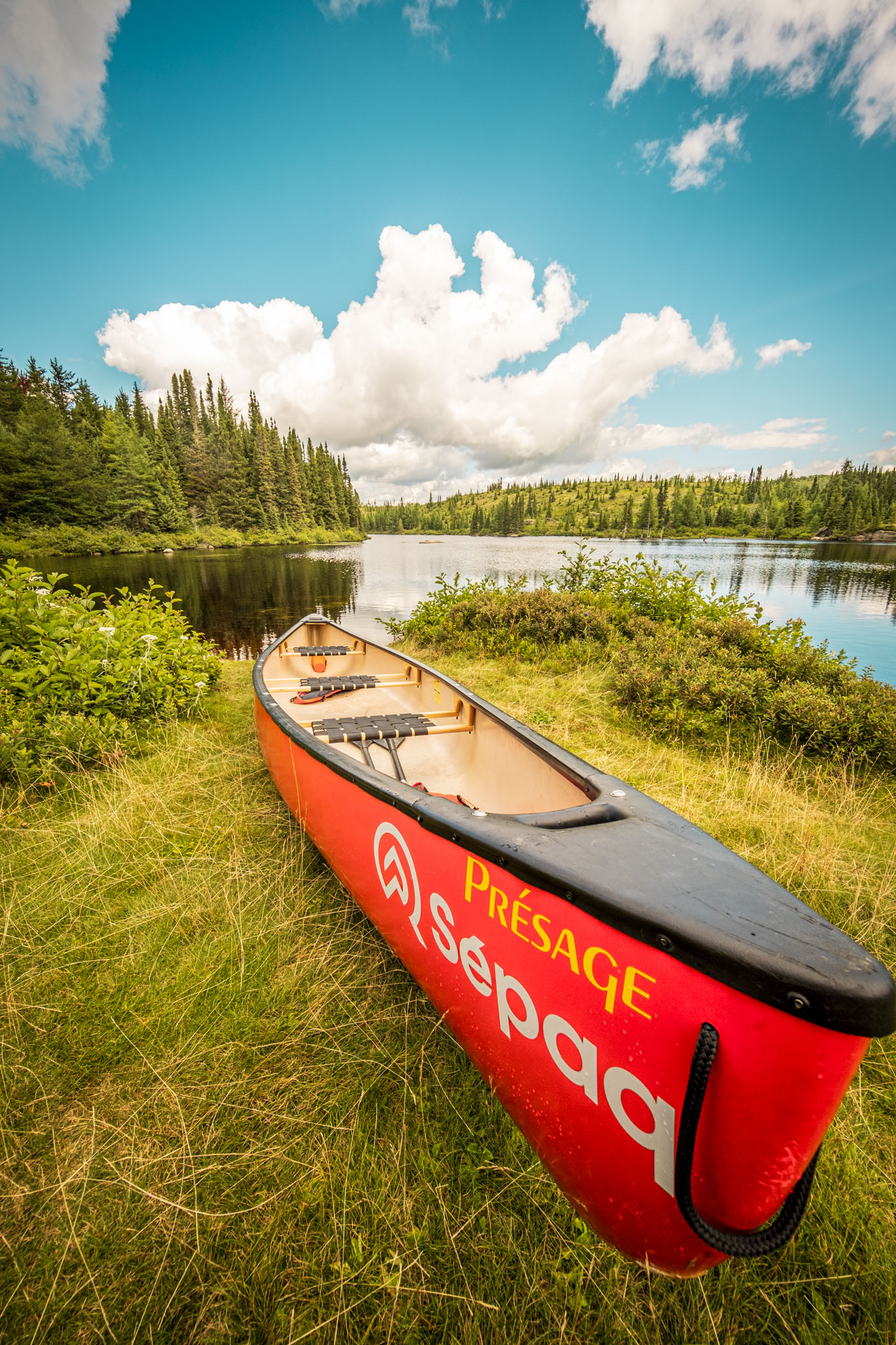 Red canoe at Barrage Wabano in Parc national des Grands-Jardins