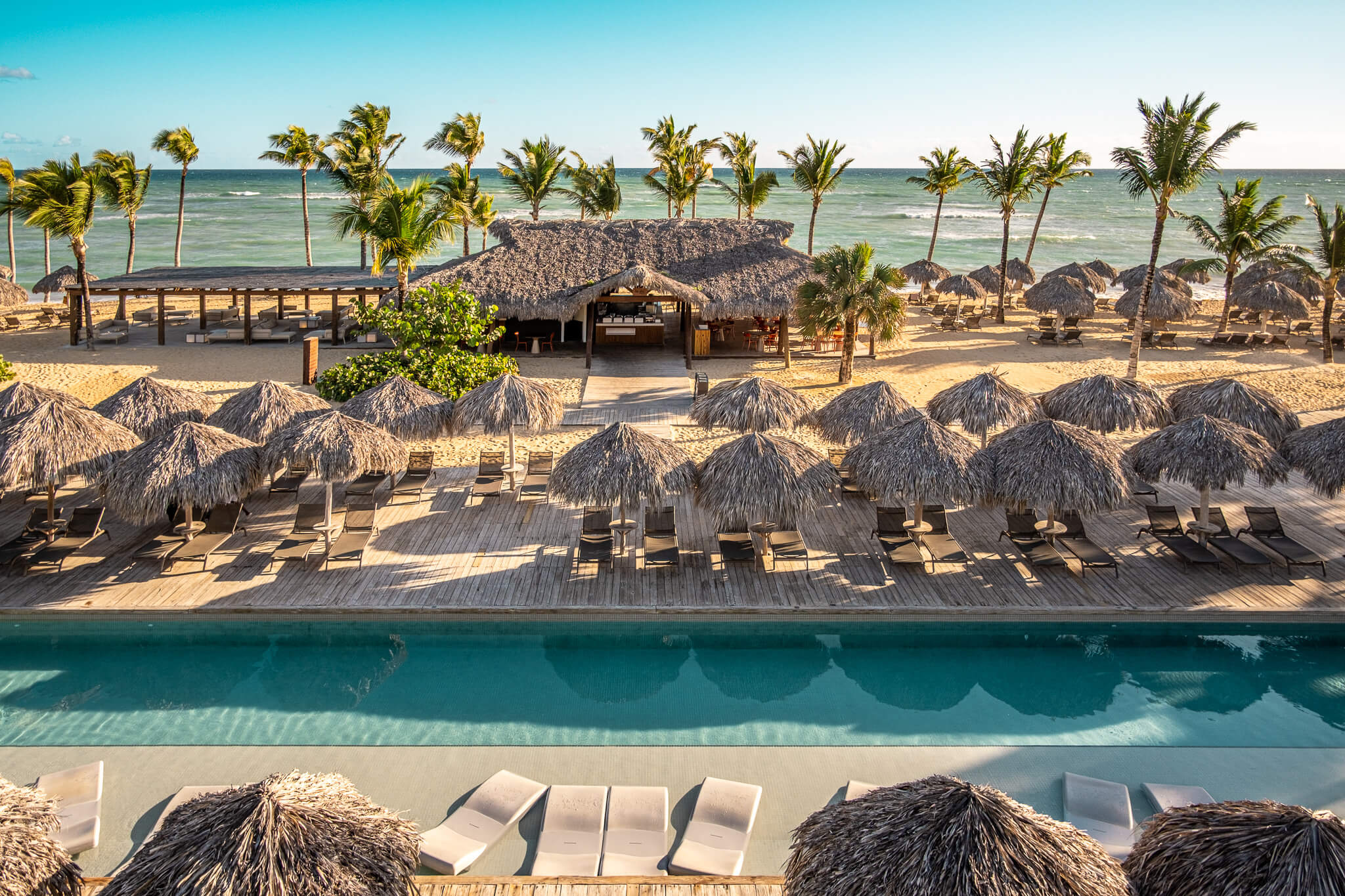 The activity pool overlook the beach at Excellence El Carmen in Punta Cana