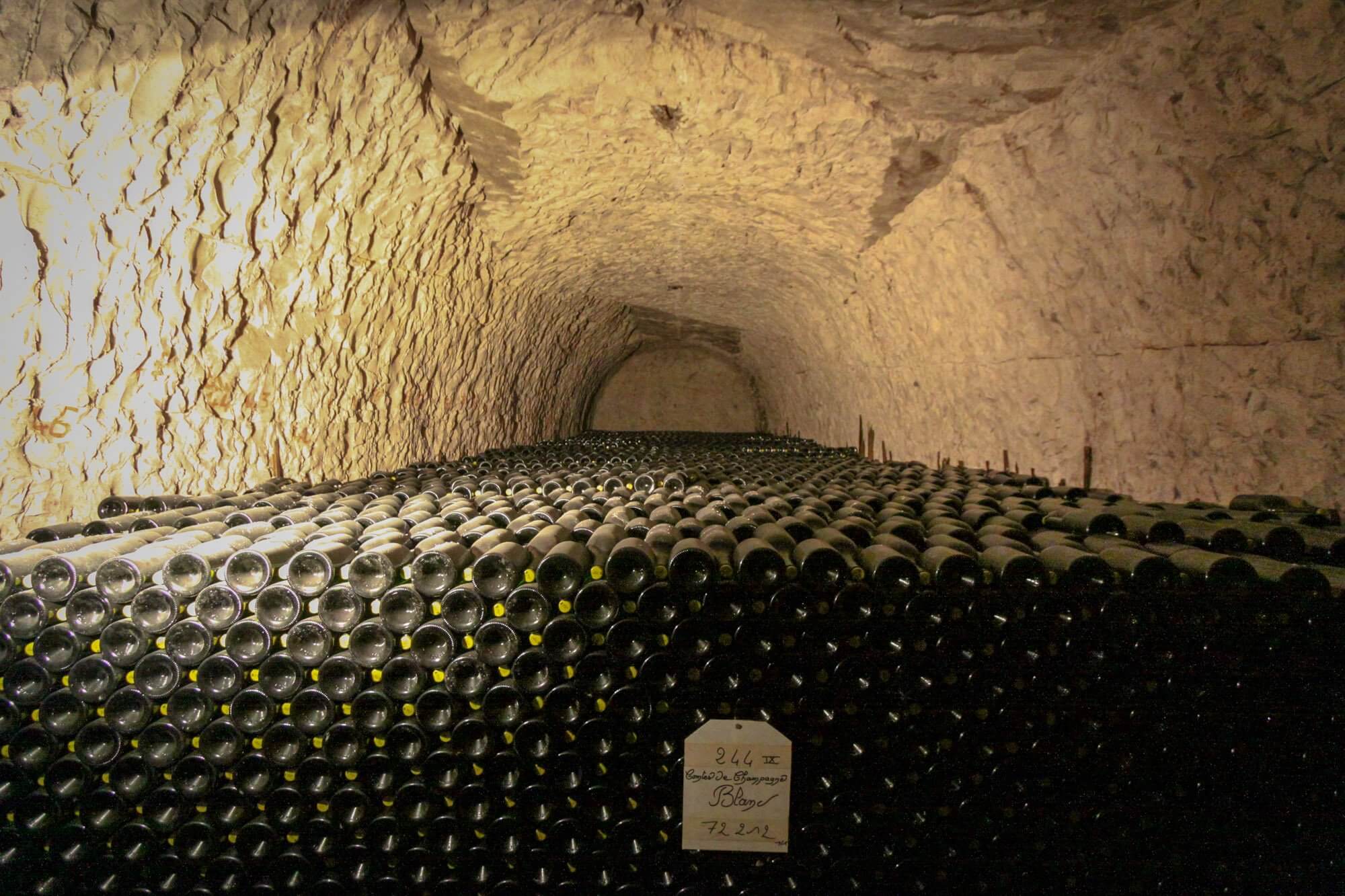 Countless bottles of champagne in the underground caves at Taittinger