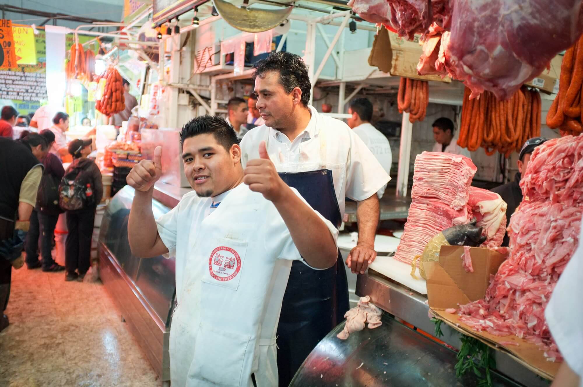 A friendly butcher at La Merced market