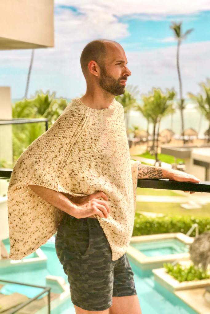 Modelling a cotton poncho on the balcony at Excellence El Carmen