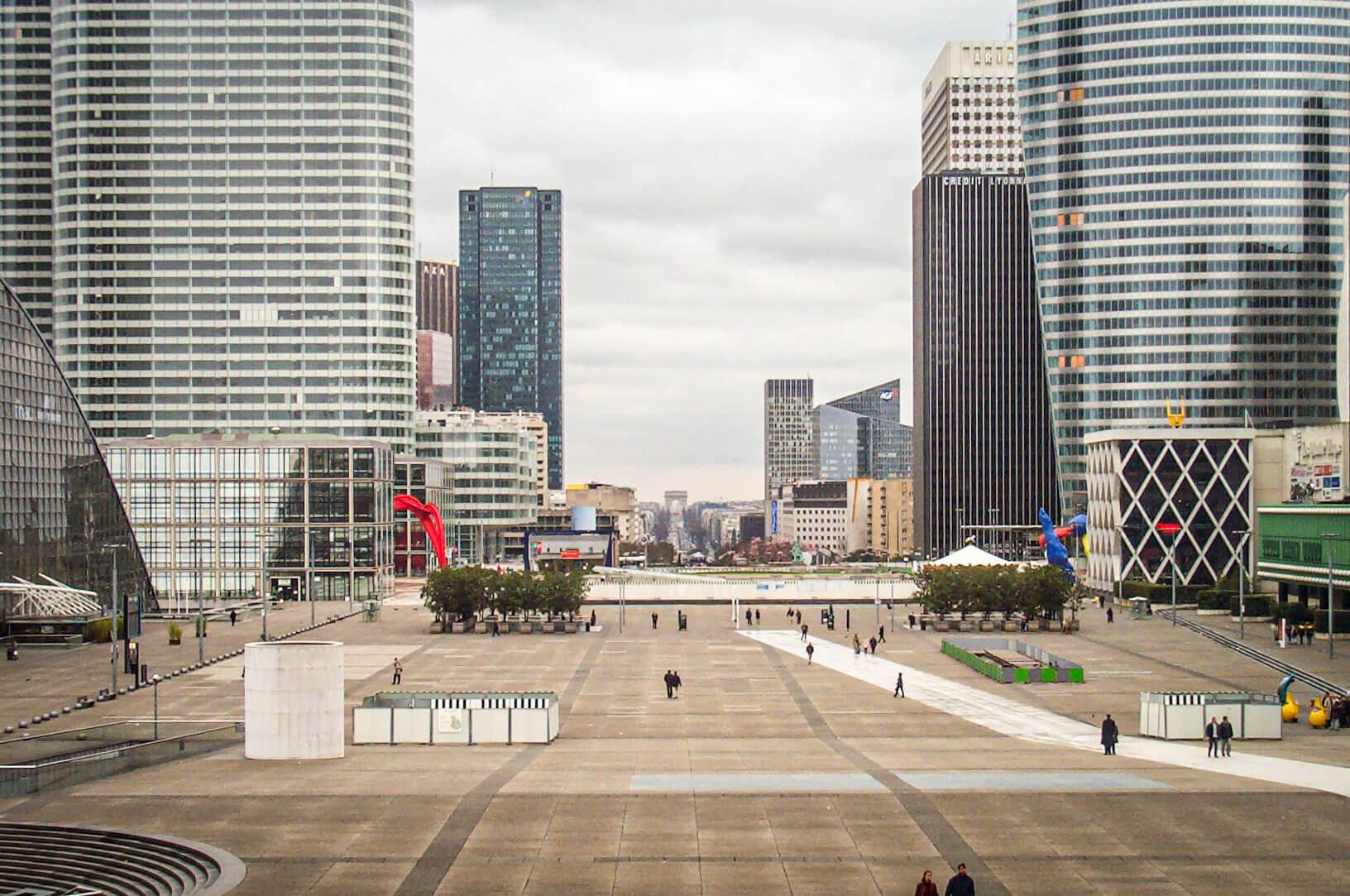 View from Grande Arche de la Défense into Paris with the Arc de Triomphe visible in the distance