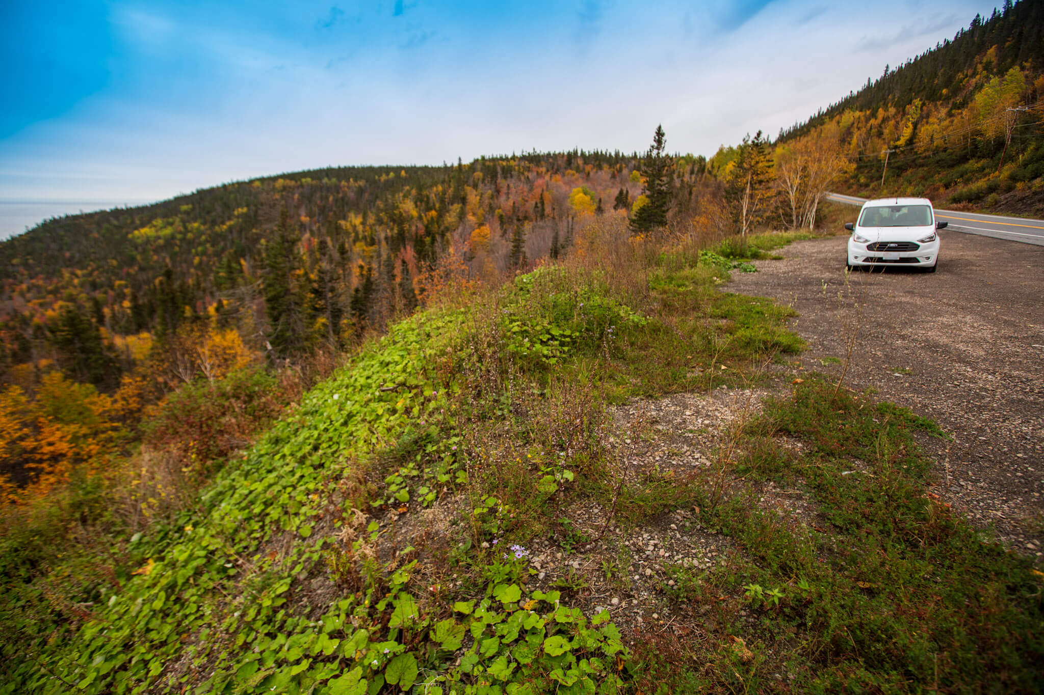 Enjoying the hilly landscape of the Gaspé peninsula in our Ford Transit Connect conversion