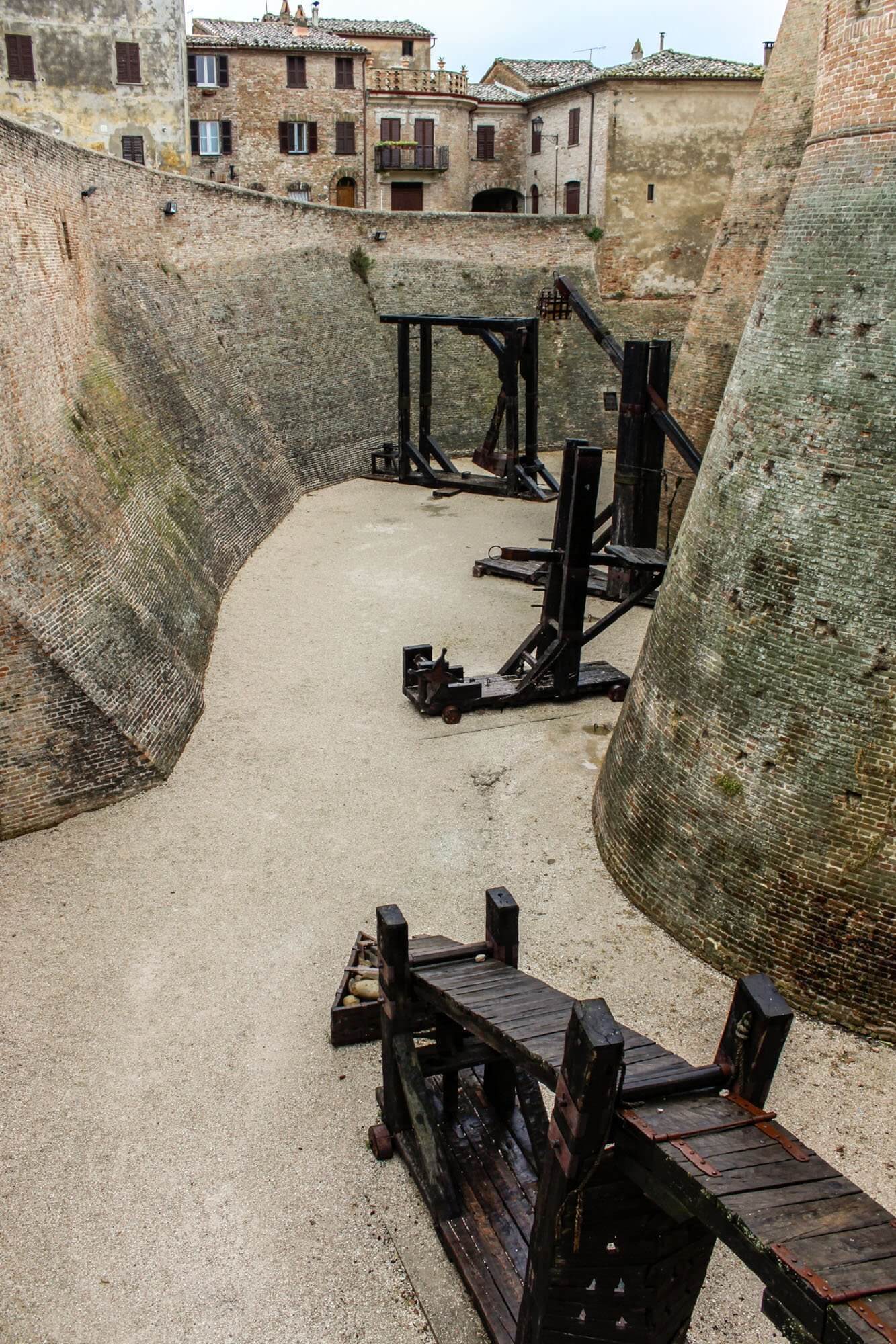 The replica war machines in the moat of the Mondavio fortress