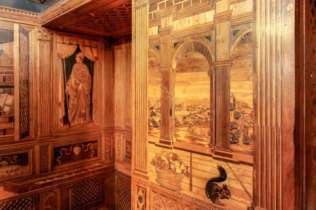 The detailed wood inlay of the Frederico III's small study or studiolo, in the Ducal Palace of Urbino