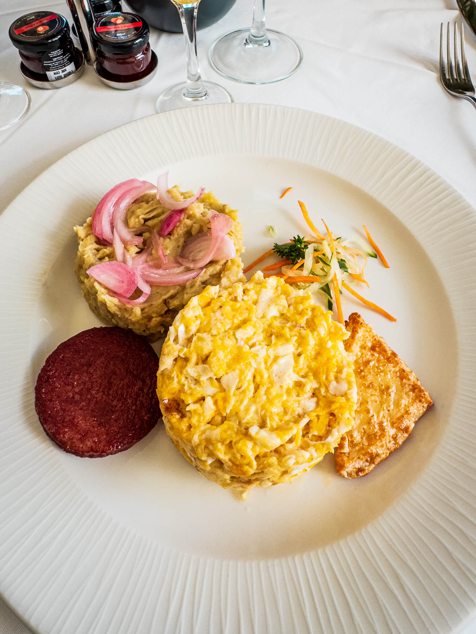 Dominican breakfast with scrambled eggs, mashed plantain, fried sausage and cheese at Excellence El Carmen's Magna restaurant