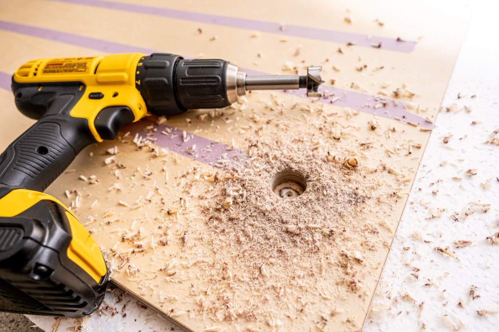 Drilling 1-inch holes in baltic birth plywood with a forstner drill bit