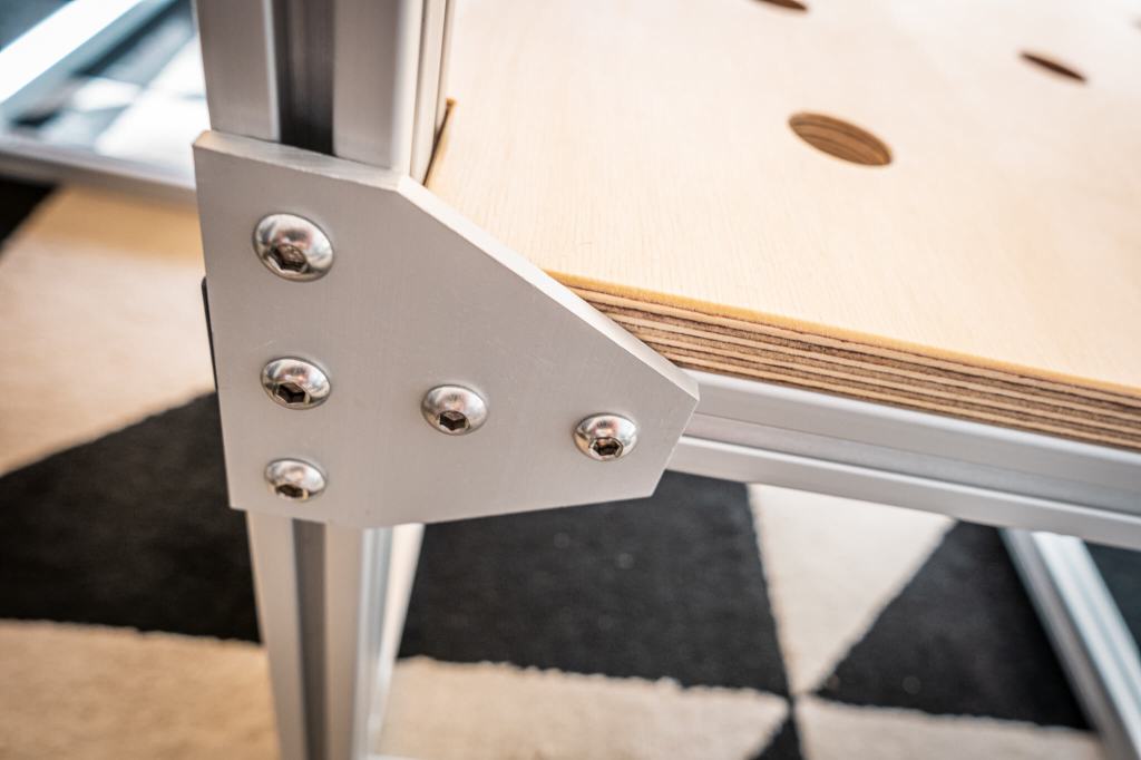 Detail of our van conversion sleeping platform made of t-slot aluminum and baltic birch plywood